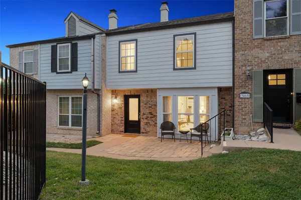 a view of an house with backyard porch and sitting area