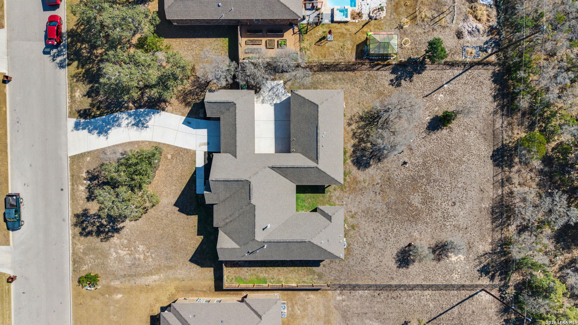 269 Big Bend Path Castroville, TX 78009 - Photo 3 of 42 an aerial view of a house with a yard and fountain