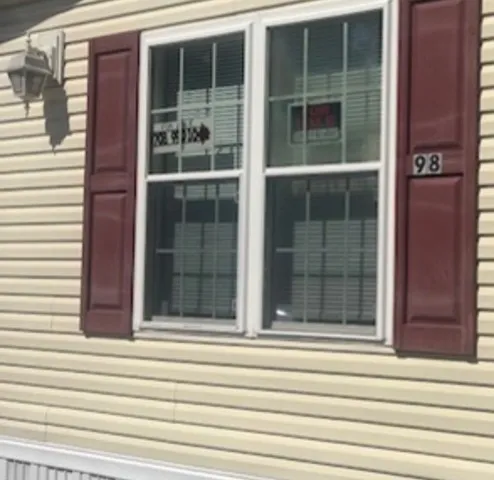 a view of a house with a door and a window