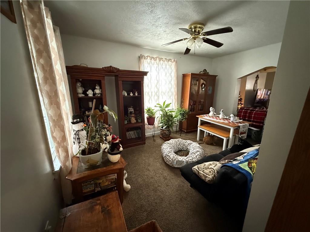 420 Negley Avenue Butler, PA 16001 - Photo 13 of 15 a view of a livingroom with furniture and a ceiling fan