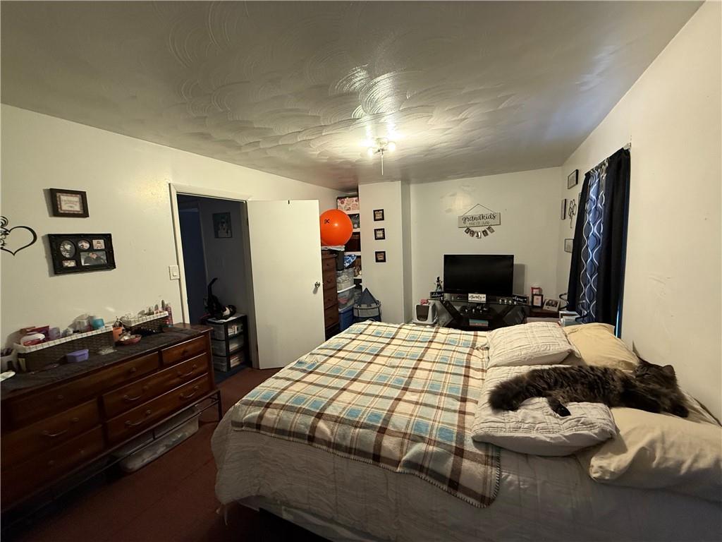 420 Negley Avenue Butler, PA 16001 - Photo 5 of 15 a bedroom with a bed and a dresser