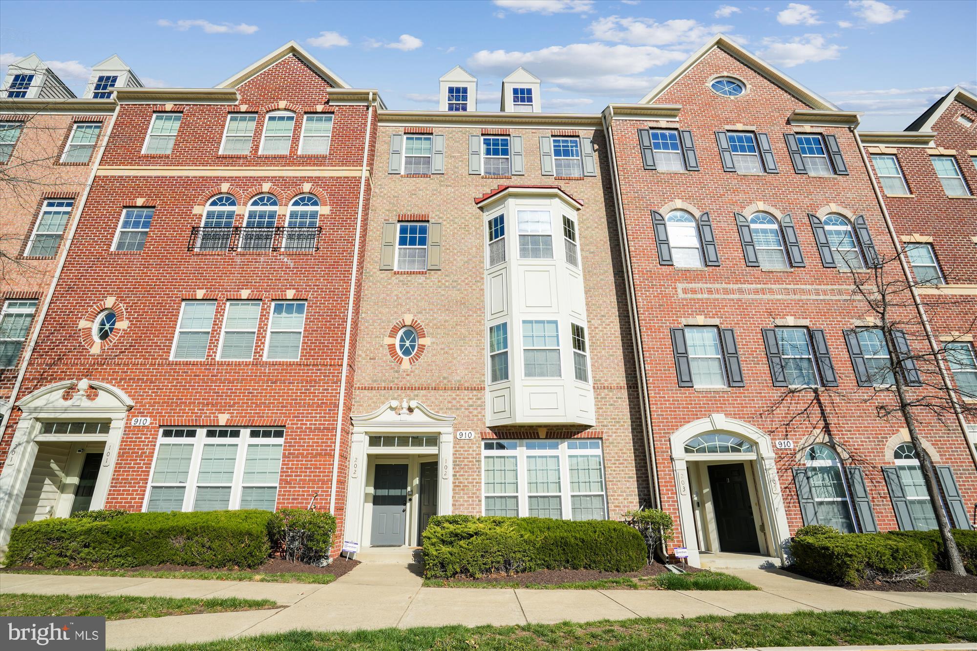 910 Hall Station Drive, Unit 202 Bowie, MD 20721 - Photo 1 of 44 a front view of a brick building