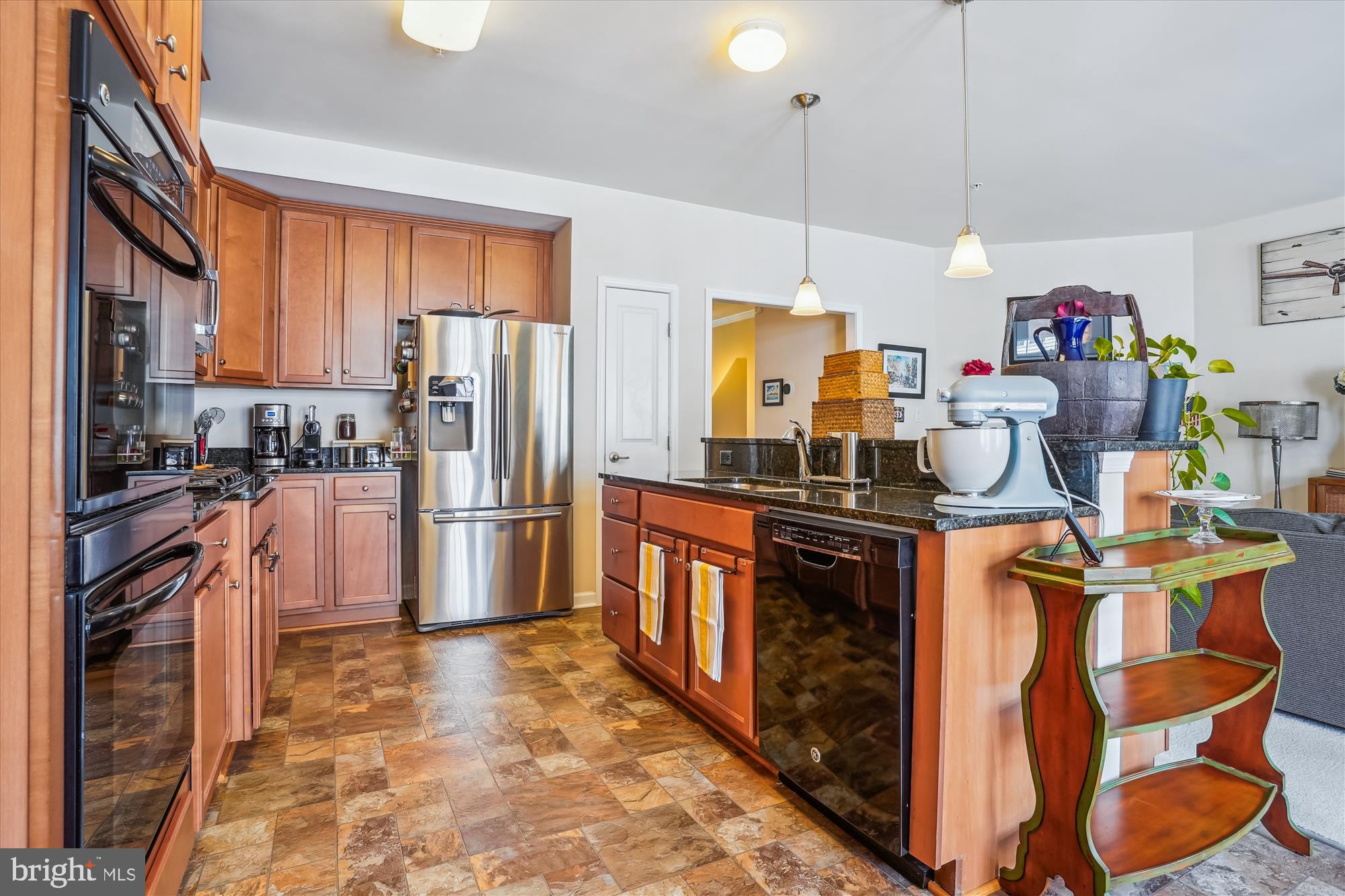 910 Hall Station Drive, Unit 202 Bowie, MD 20721 - Photo 14 of 44 a kitchen with stainless steel appliances granite countertop a stove refrigerator and cabinets