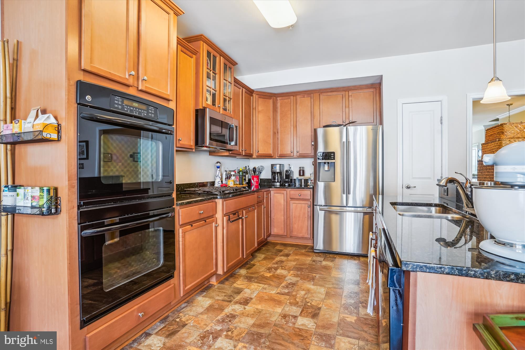 910 Hall Station Drive, Unit 202 Bowie, MD 20721 - Photo 16 of 44 a kitchen with a sink stove and refrigerator