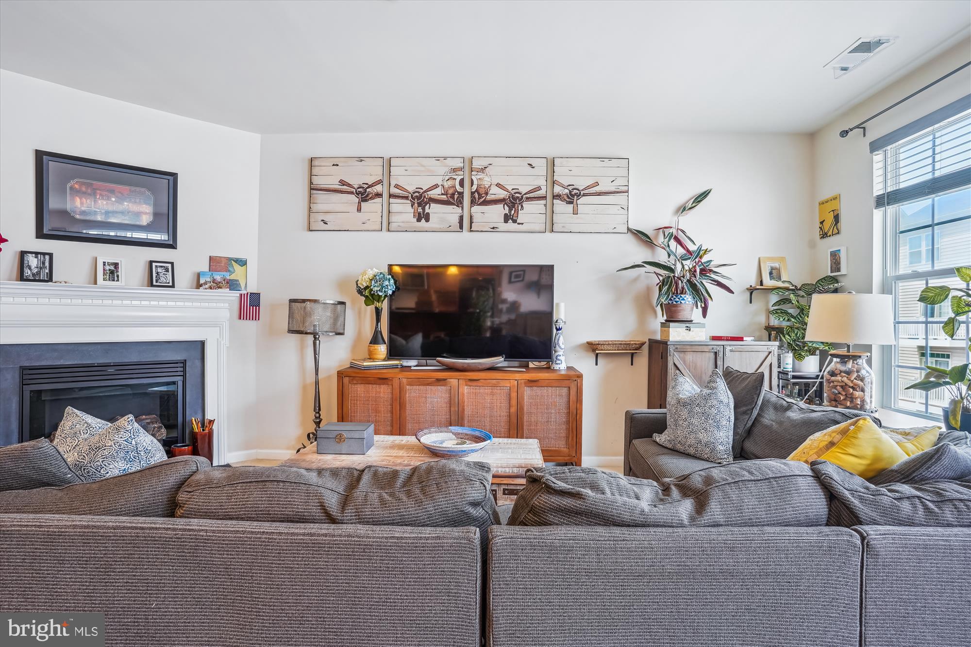 910 Hall Station Drive, Unit 202 Bowie, MD 20721 - Photo 22 of 44 a living room with furniture and a flat screen tv