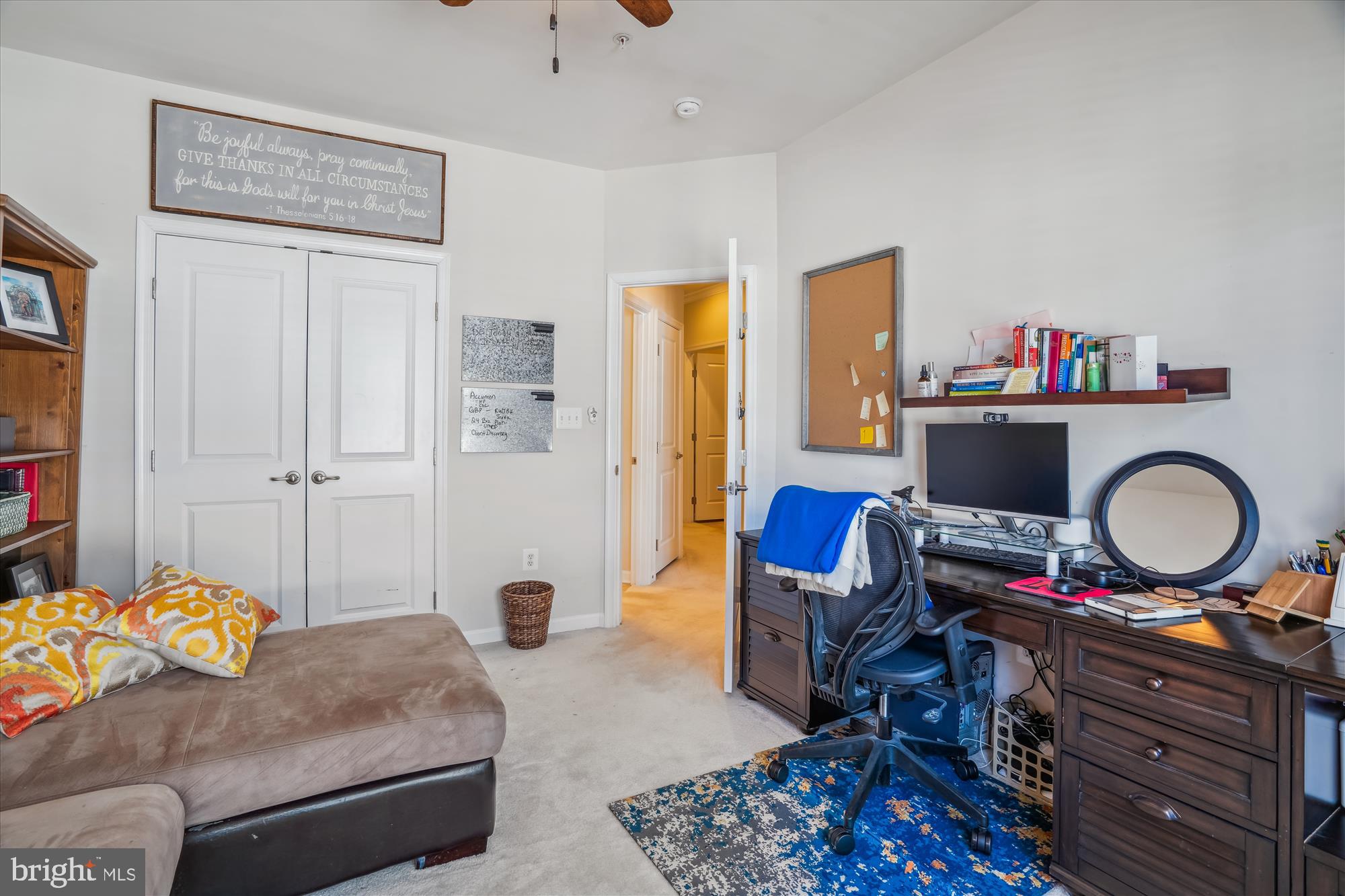 910 Hall Station Drive, Unit 202 Bowie, MD 20721 - Photo 27 of 44 a living room with furniture and a wooden floor