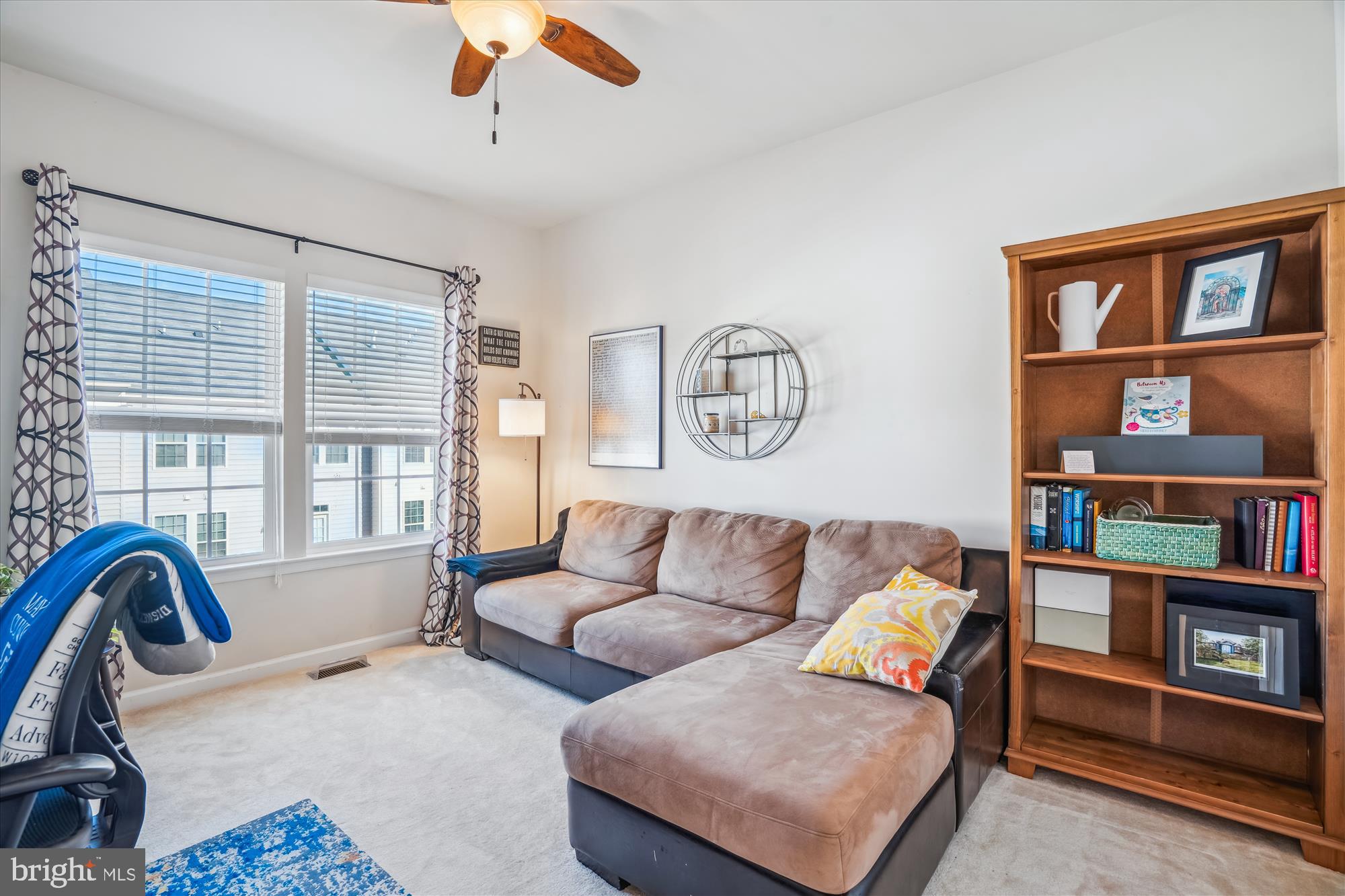 910 Hall Station Drive, Unit 202 Bowie, MD 20721 - Photo 28 of 44 a living room with furniture and a window