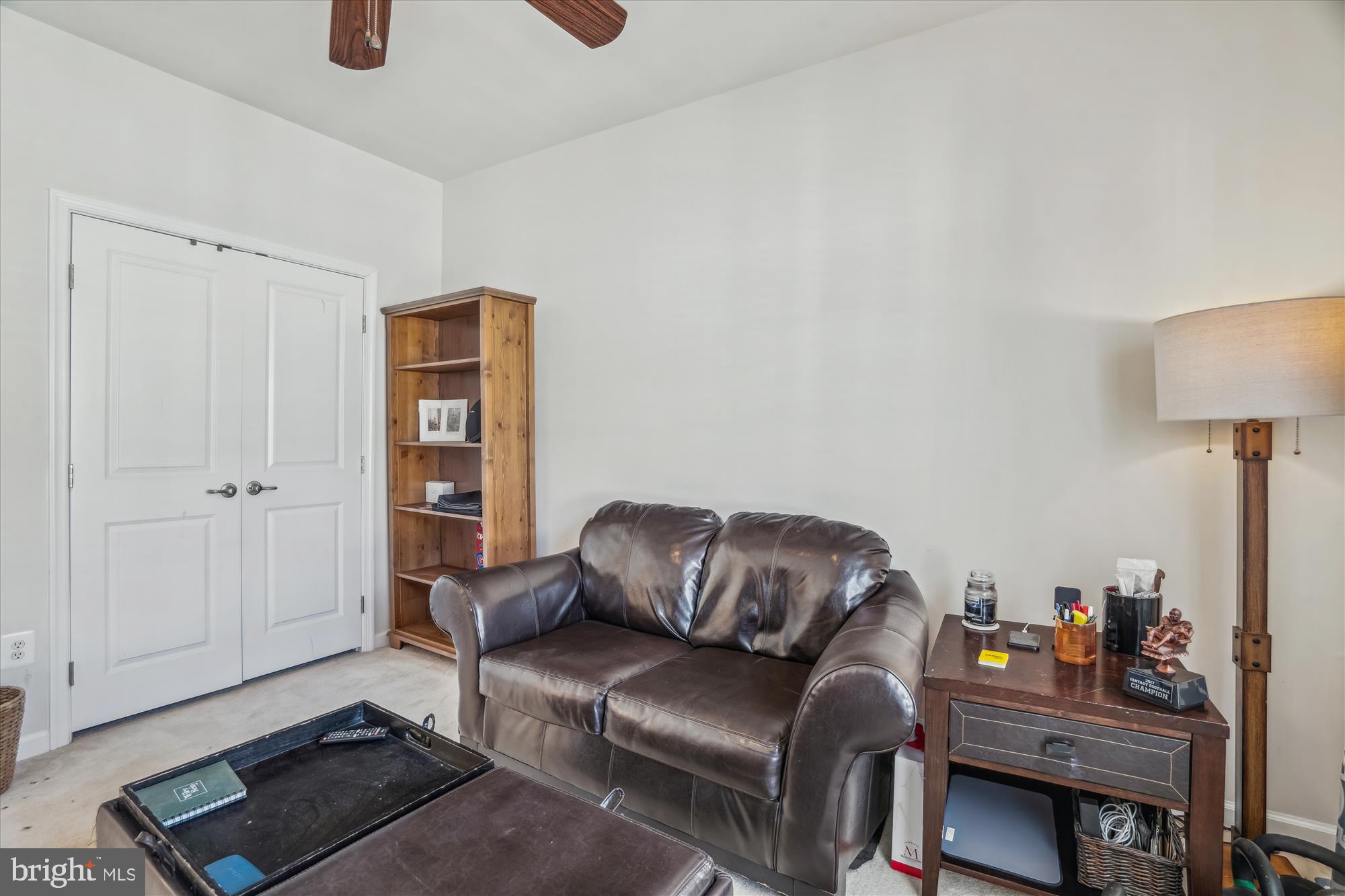 910 Hall Station Drive, Unit 202 Bowie, MD 20721 - Photo 30 of 44 a livingroom with furniture and a couch