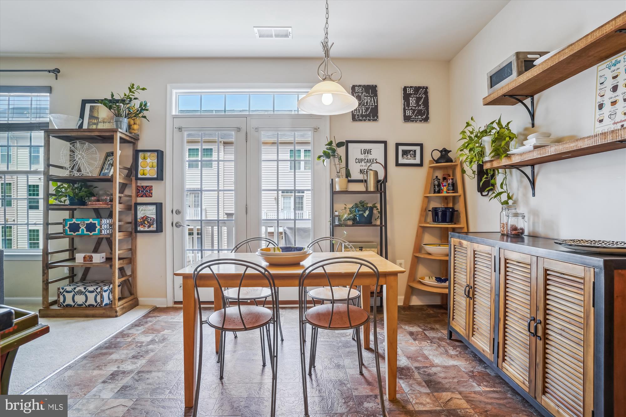 910 Hall Station Drive, Unit 202 Bowie, MD 20721 - Photo 36 of 44 a view of a dining room with furniture