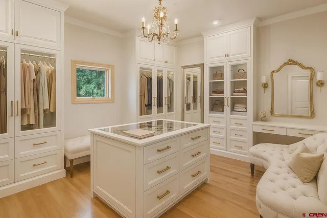 a kitchen that has a stove and a table in it