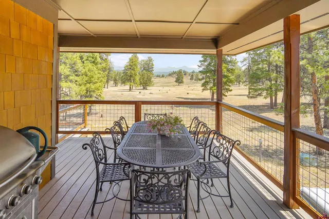 a view of a city from a dining room with furniture window and outside view