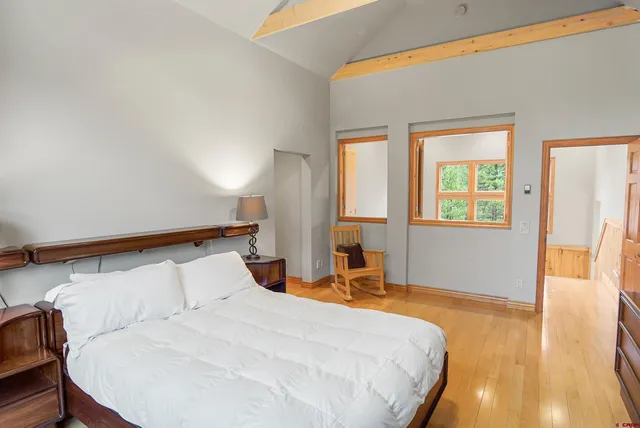 a bathroom with a toilet and a shower curtain