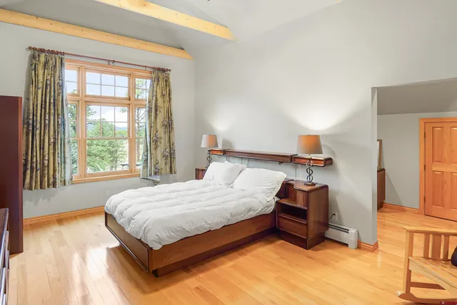 a bathroom with a toilet and a shower curtain
