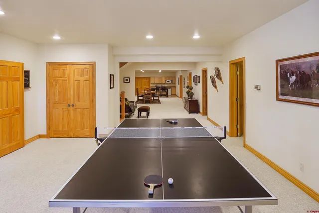 a media room with lots of chairs and a projector