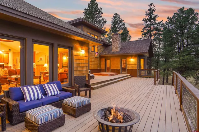 a balcony with furniture and a potted plant
