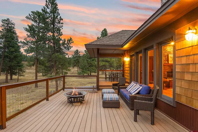 a view of a balcony with couch and wooden floor