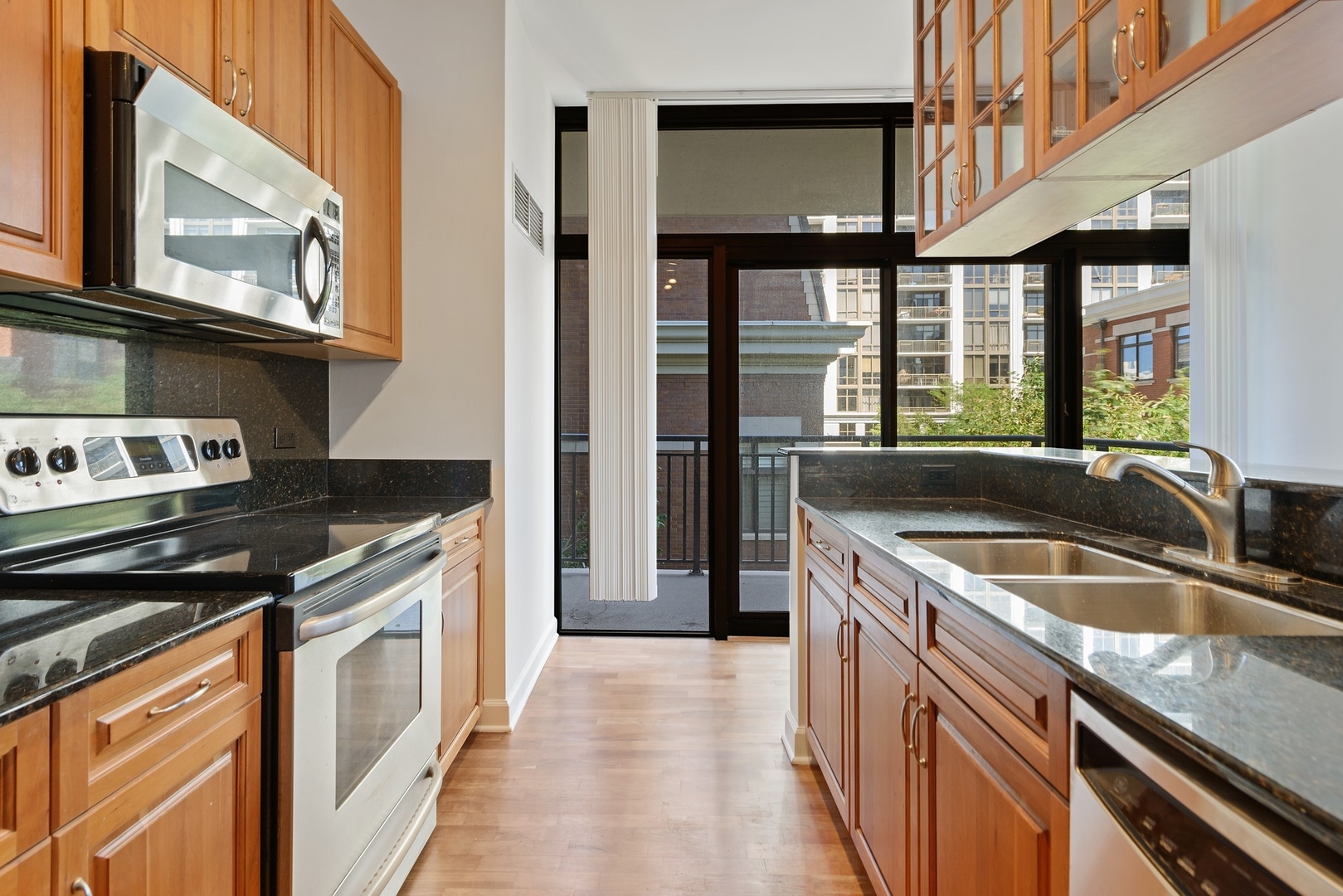1322 South Prairie Avenue, Unit 302 Chicago, IL 60605 - Photo 7 of 13 a kitchen that has a sink and a stove