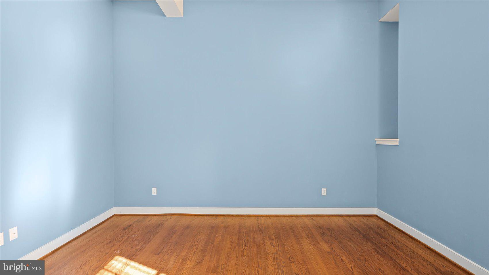 1100 North Calvert Street, Unit 2 Baltimore, MD 21202 - Photo 15 of 34 a view of an empty room with wooden floor