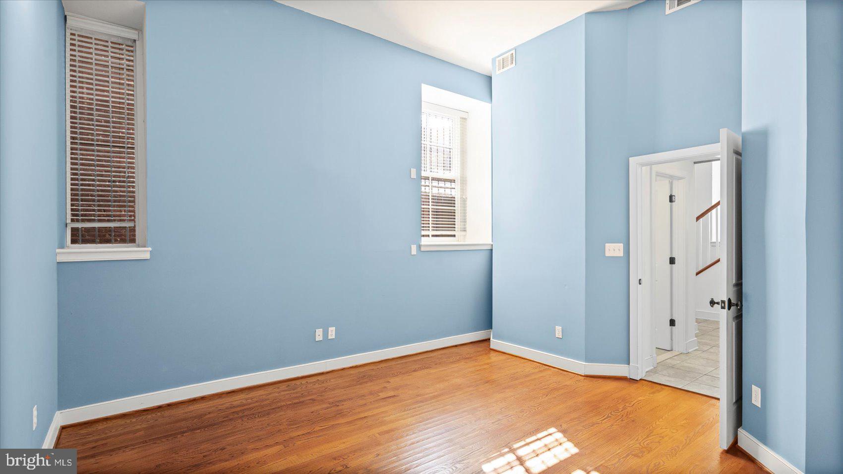 1100 North Calvert Street, Unit 2 Baltimore, MD 21202 - Photo 16 of 34 an empty room with windows
