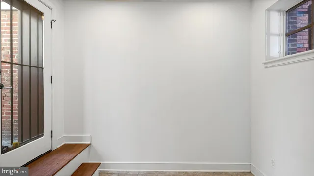 an empty room with windows