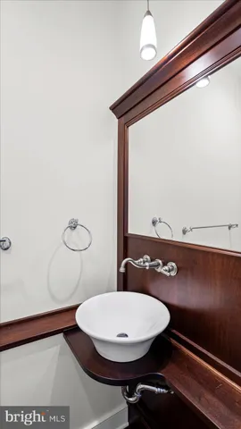 a view of a bathroom with a sink and a mirror