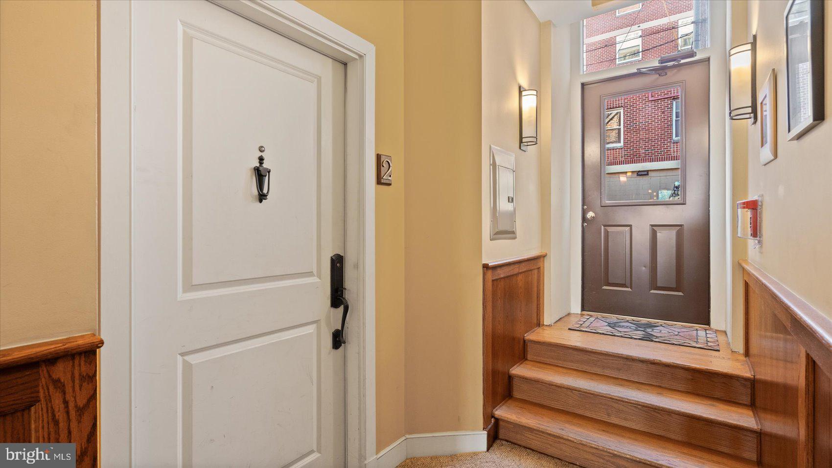 1100 North Calvert Street, Unit 2 Baltimore, MD 21202 - Photo 34 of 34 a view of a hallway with wooden floor and staircase