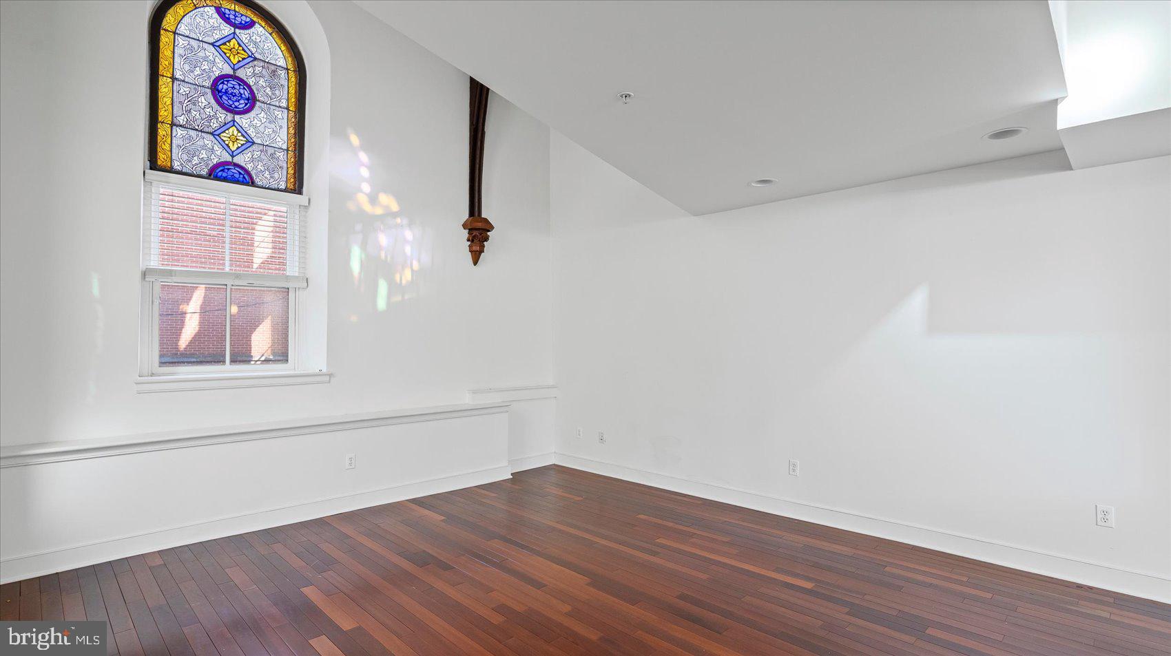 1100 North Calvert Street, Unit 2 Baltimore, MD 21202 - Photo 10 of 34 a view of an empty room with wooden floor