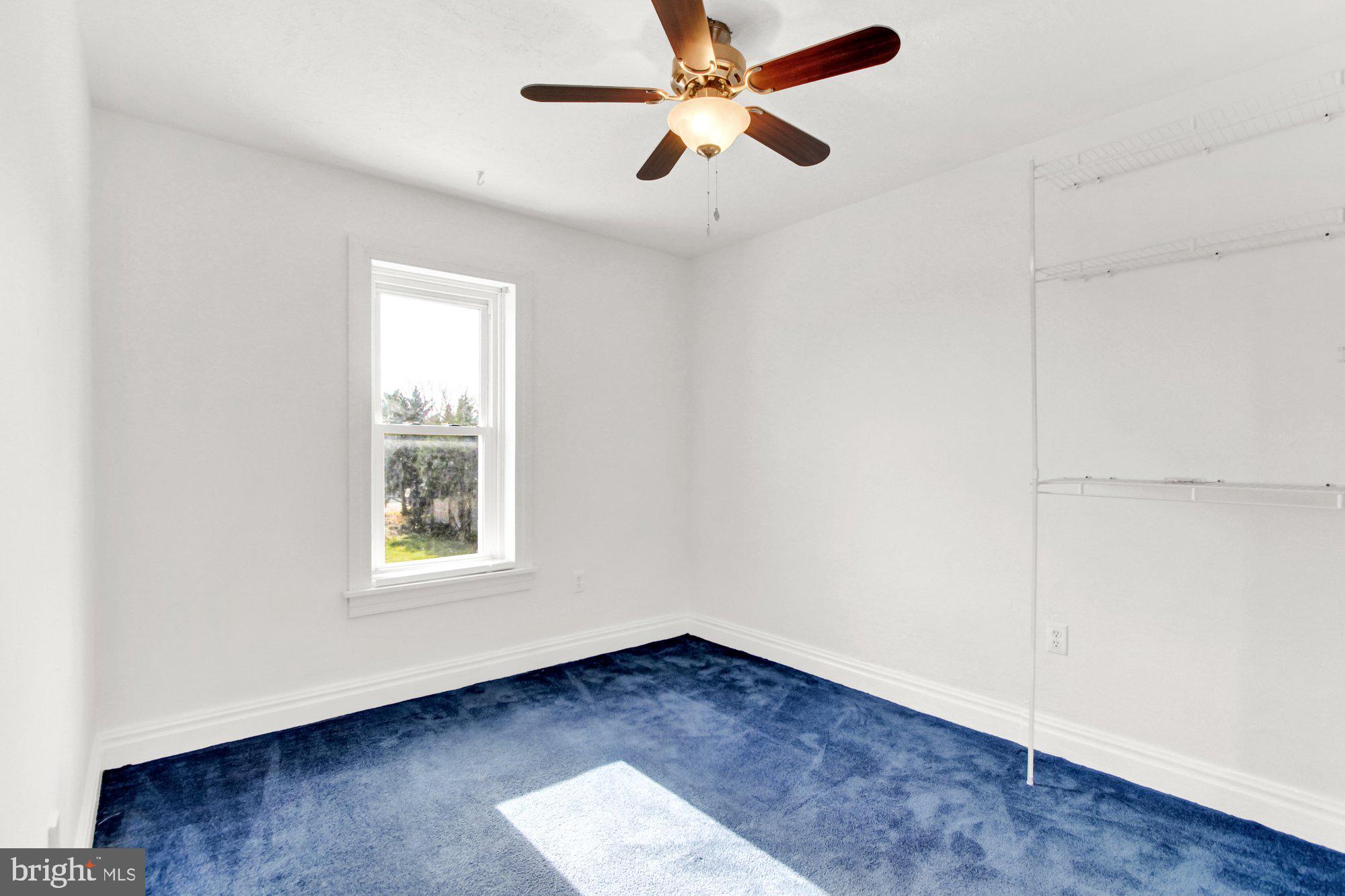 2861 Centennial Road Hanover, PA 17331 - Photo 16 of 26 an empty room with wooden floor ceiling fan and windows