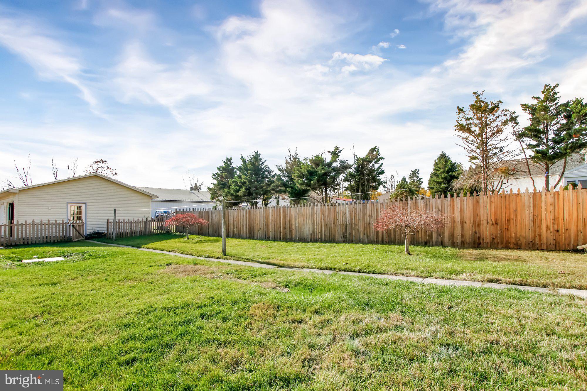 2861 Centennial Road Hanover, PA 17331 - Photo 25 of 26 a view of a backyard with potted plants and wooden fence