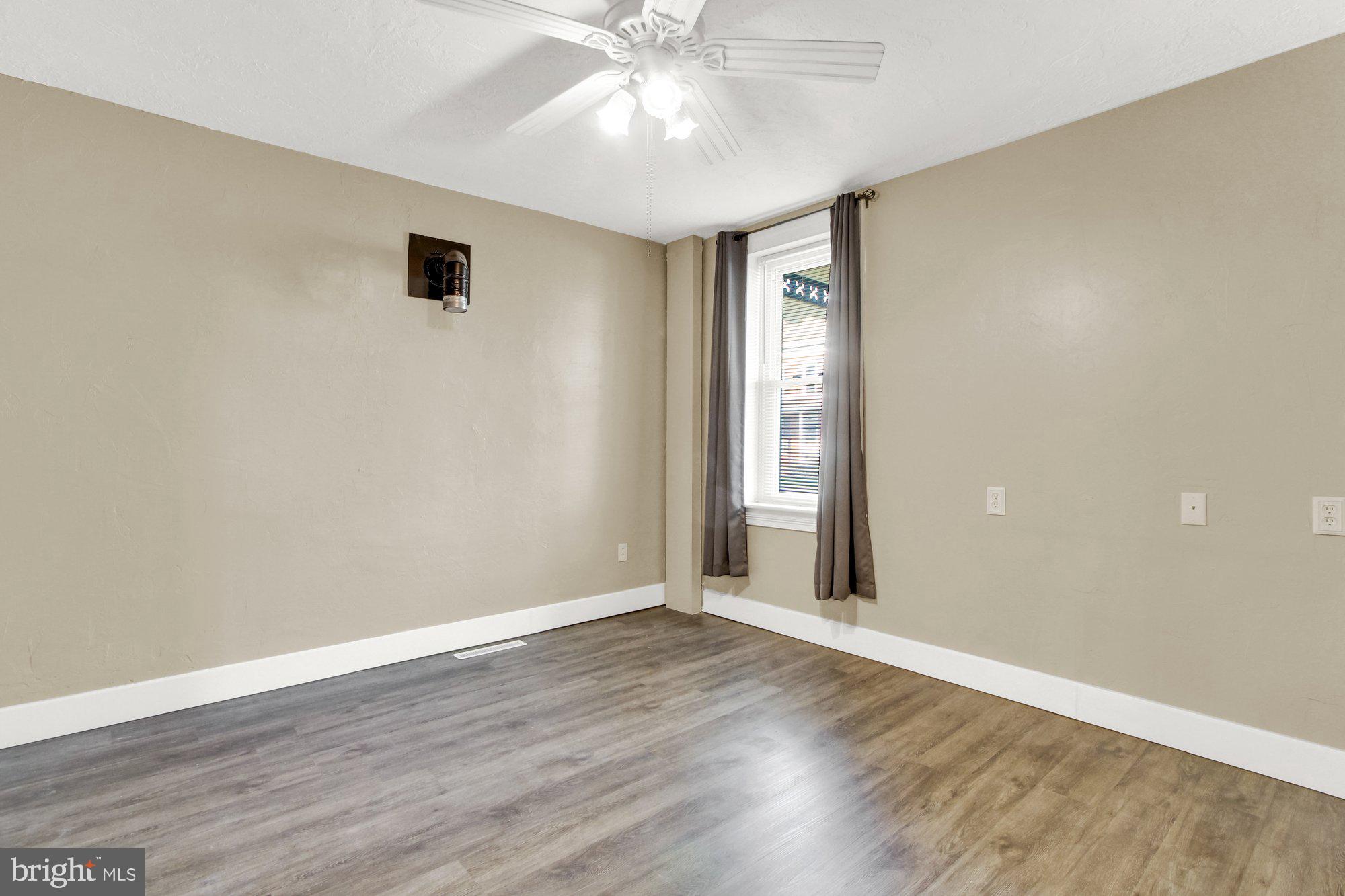 2861 Centennial Road Hanover, PA 17331 - Photo 6 of 26 an empty room with wooden floor and windows