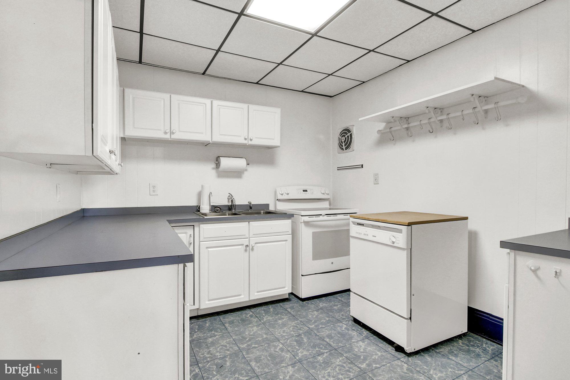 2861 Centennial Road Hanover, PA 17331 - Photo 9 of 26 a kitchen with cabinets appliances a sink and a counter top space