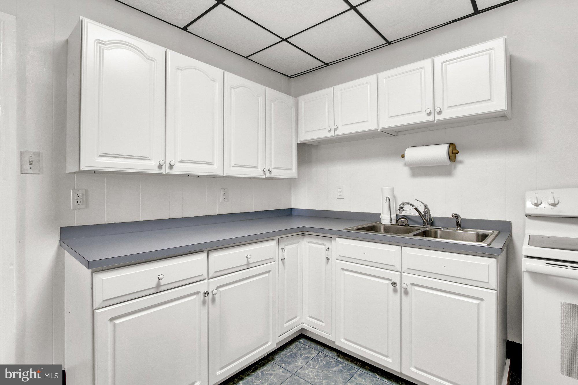 2861 Centennial Road Hanover, PA 17331 - Photo 10 of 26 a kitchen with granite countertop white cabinets and white appliances