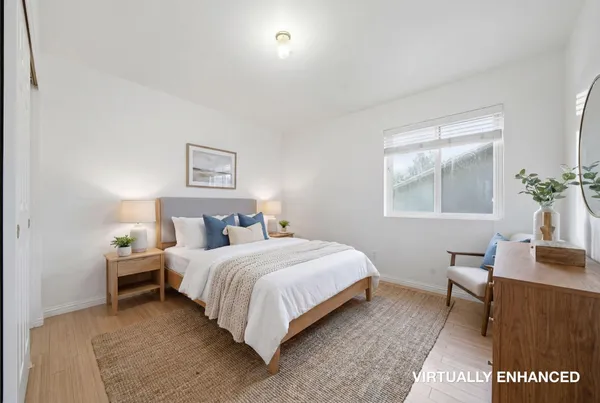a bedroom with a bed and a table in it