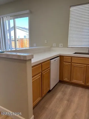 a spacious bathroom with a sink and a window