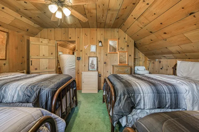 a view of house with a yard