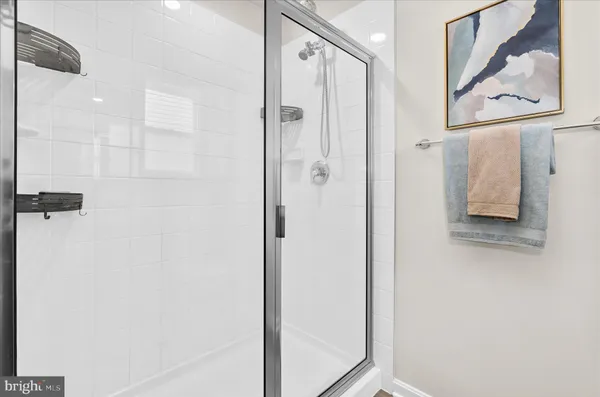 a bathroom with a shower and a sink