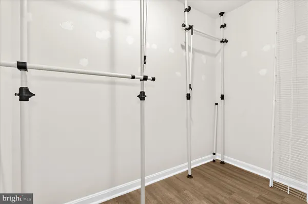 a view of a room with wooden floor
