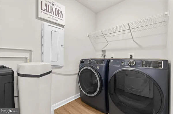 a view of a hallway with washer and dryer