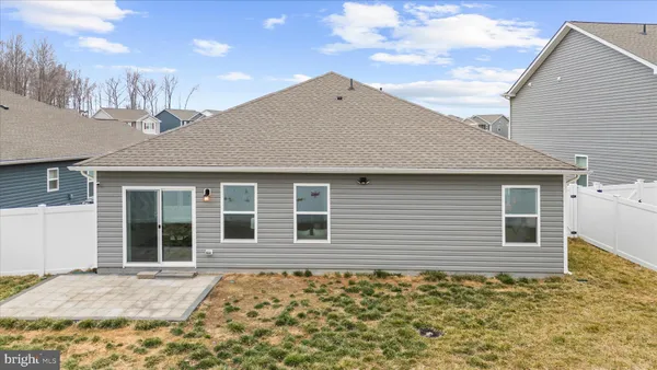 a house with trees in the background