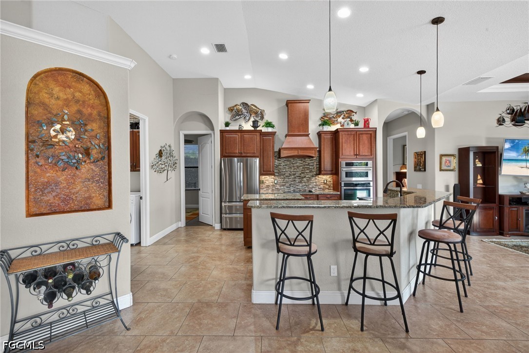 6109 Calusa Rdg Trail Bokeelia, FL 33922 - Photo 17 of 48 a dining hall with a dining table and chairs