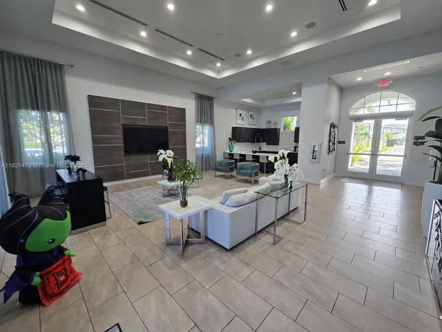 a living room with fireplace furniture and a flat screen tv