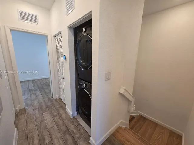 a view of hallway with washer and dryer