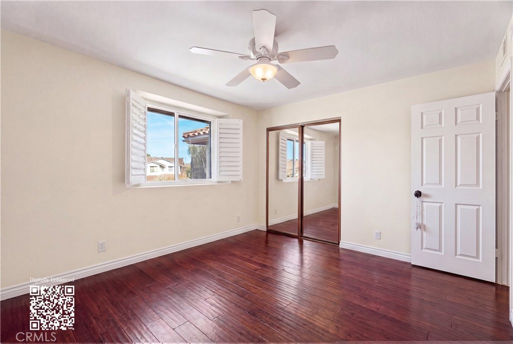 21732 Exton Way Lake Forest, CA 92630 - Photo 31 of 52 Top floor bedrooms with ceiling fan and wooden shutters. Personal items digitally remove, find originals here https://bit.ly/3OvKmPn