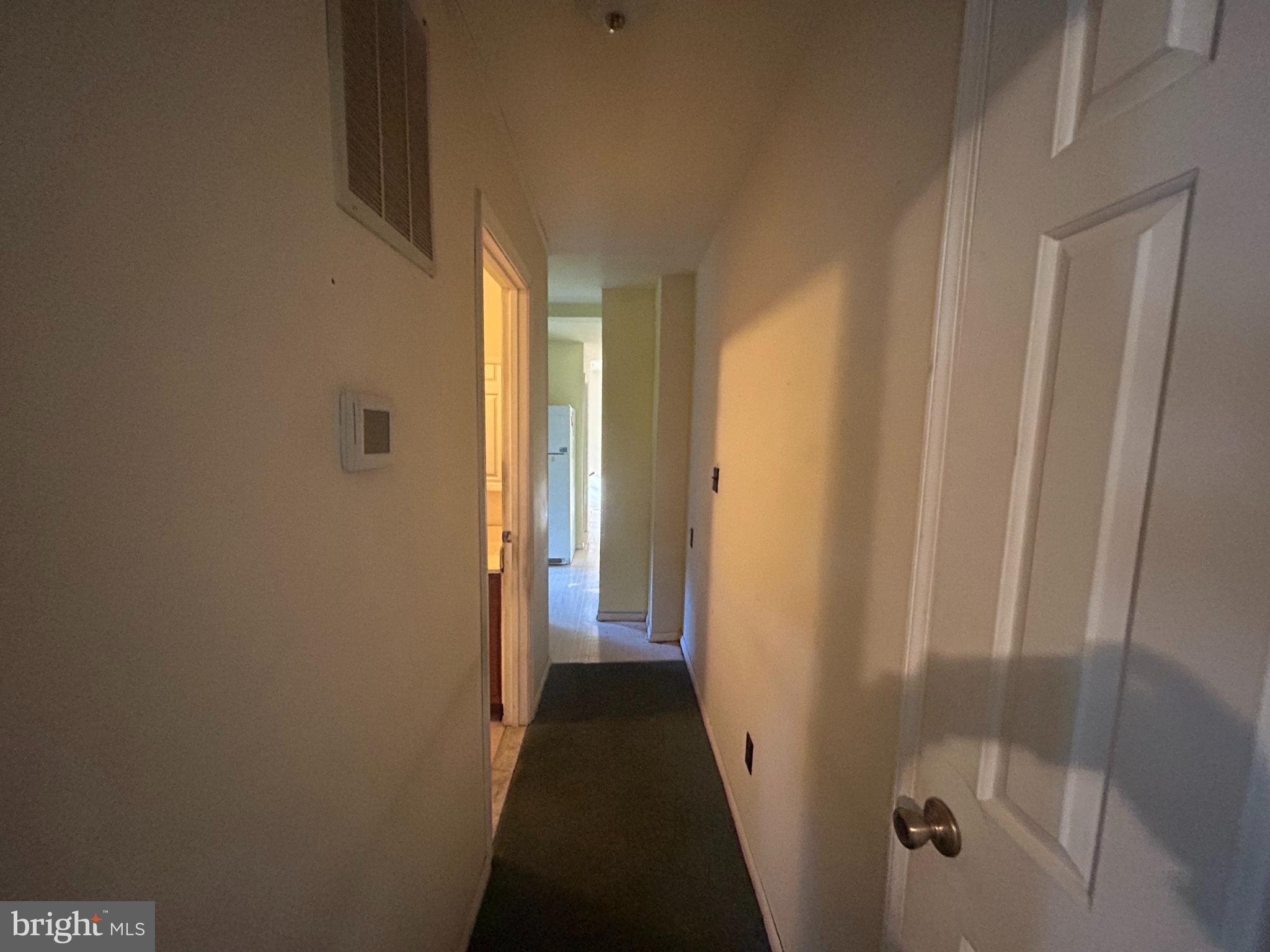 15325 Holly Grove Road Silver Spring, MD 20905 - Photo 13 of 27 a view of a bathroom from a hallway