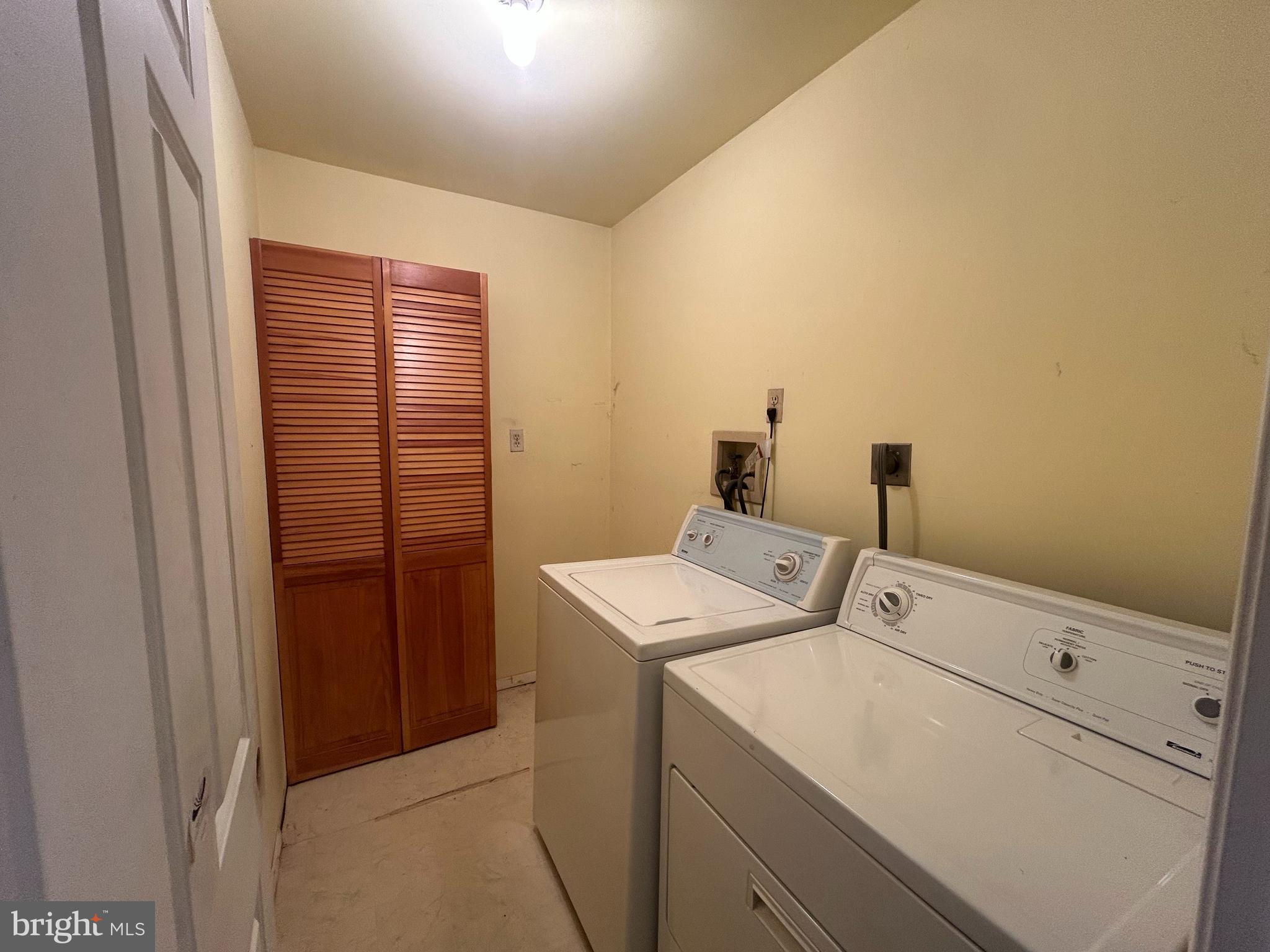 15325 Holly Grove Road Silver Spring, MD 20905 - Photo 16 of 27 a utility room with dryer and washer
