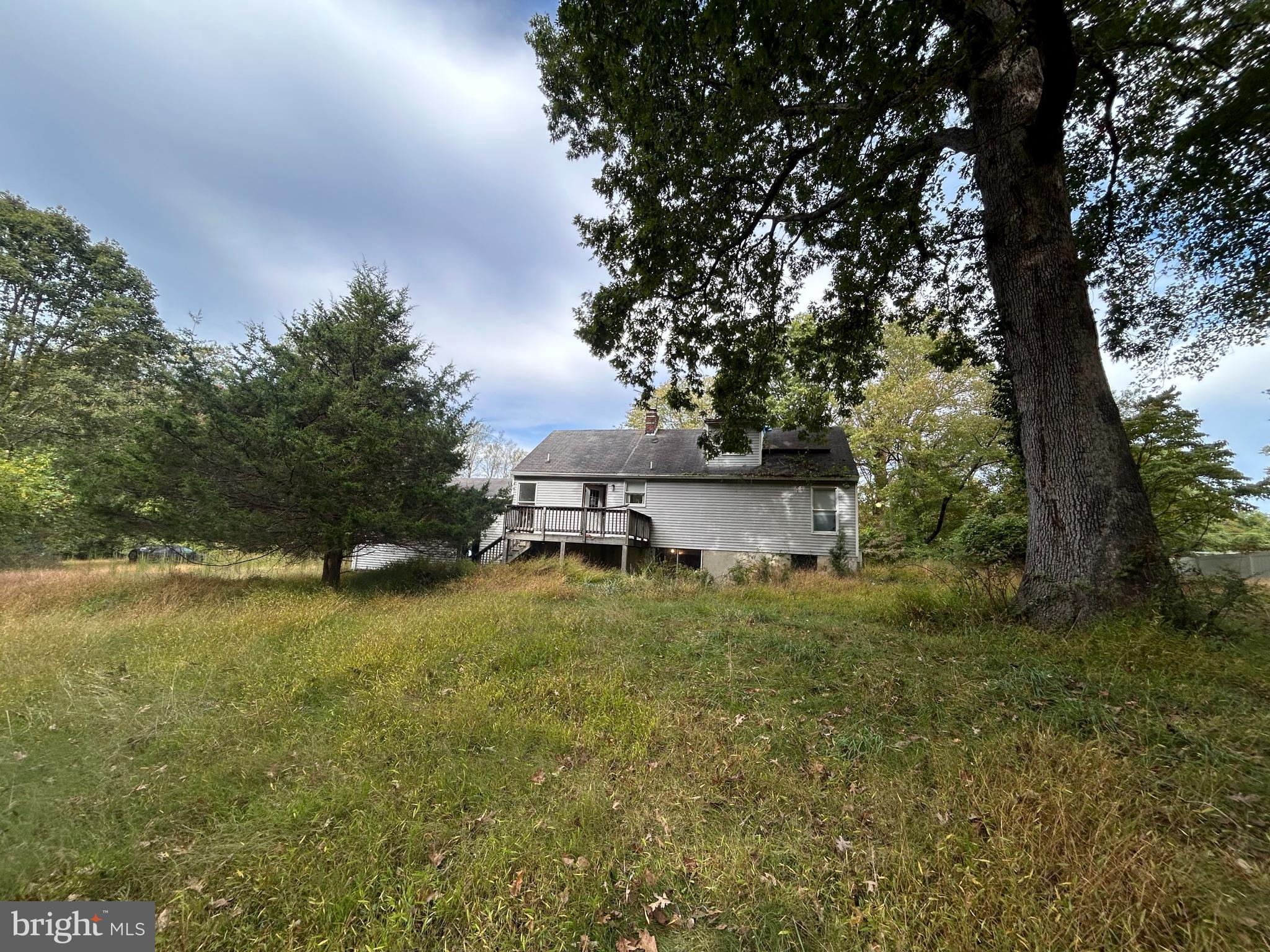 15325 Holly Grove Road Silver Spring, MD 20905 - Photo 5 of 27 a view of a house with a yard