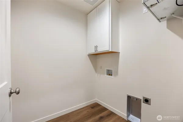 an empty room with windows and entrance