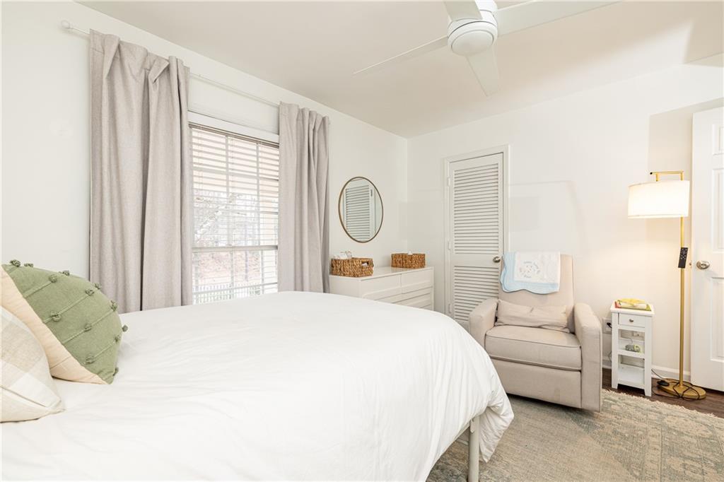 1101 Collier Road Northwest, Unit A4 Atlanta, GA 30318 - Photo 18 of 27 a bedroom with a large bed and a window