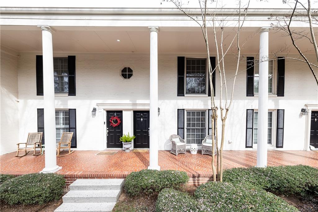 1101 Collier Road Northwest, Unit A4 Atlanta, GA 30318 - Photo 2 of 27 a front view of a house with a yard