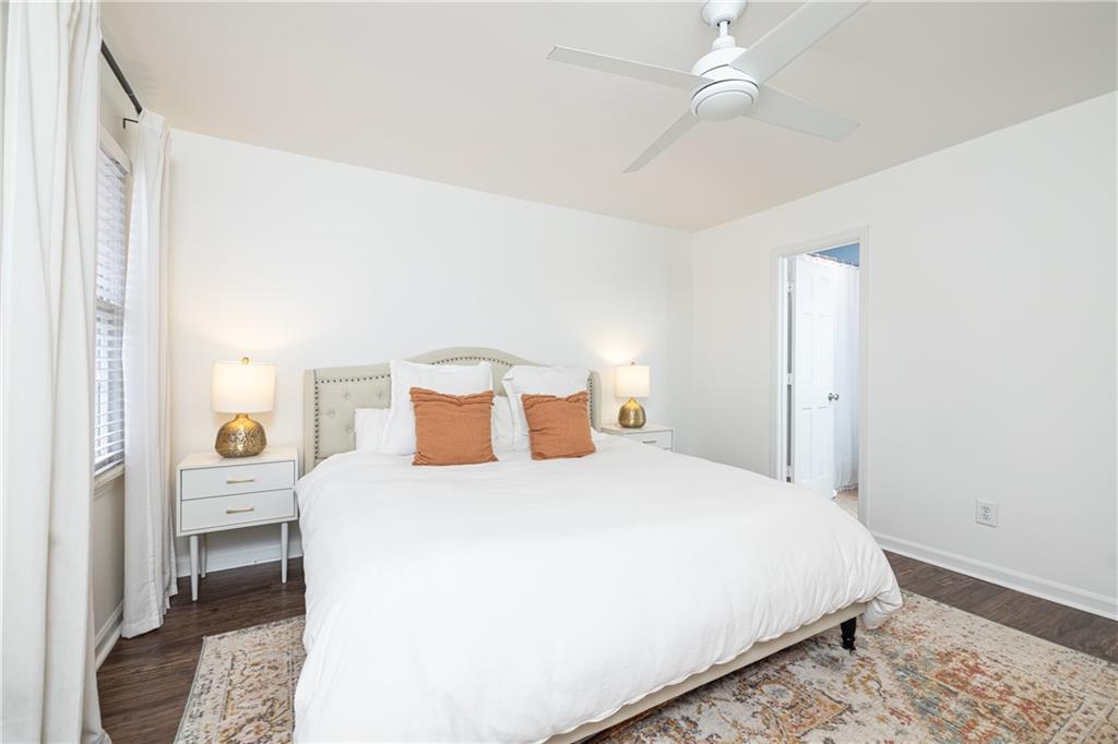 1101 Collier Road Northwest, Unit A4 Atlanta, GA 30318 - Photo 21 of 27 a bedroom with a bed and a closet